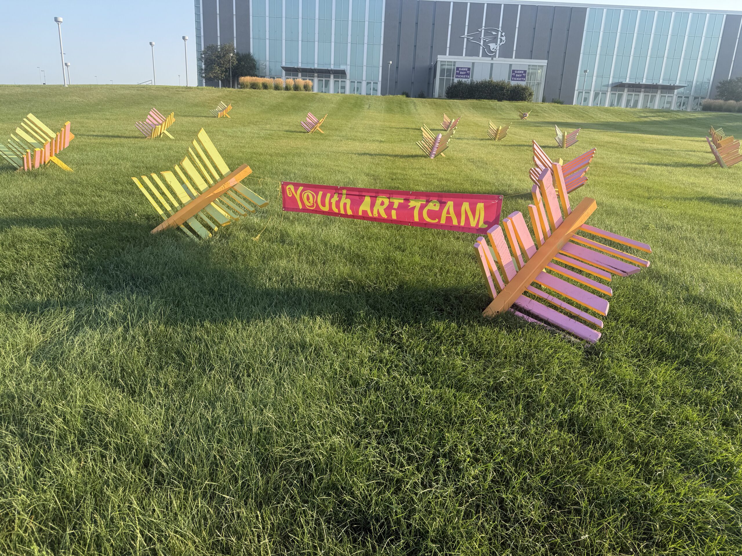 The butterflies, made my Youth Art Team, are located in the South lawn of the McLeod Center.